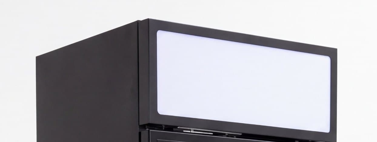 Black fridge cabinet with the lit header panel on top